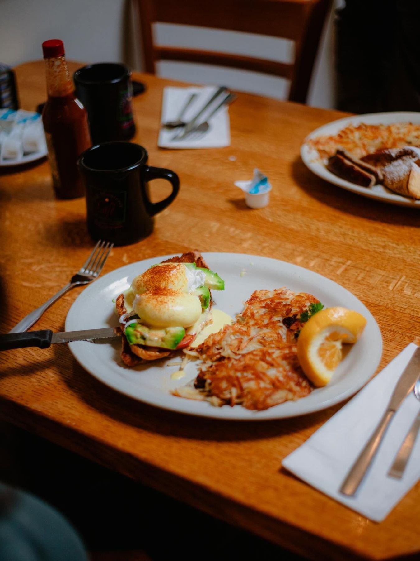 Dungeness crab eggs Benedict with avocado and hash browns