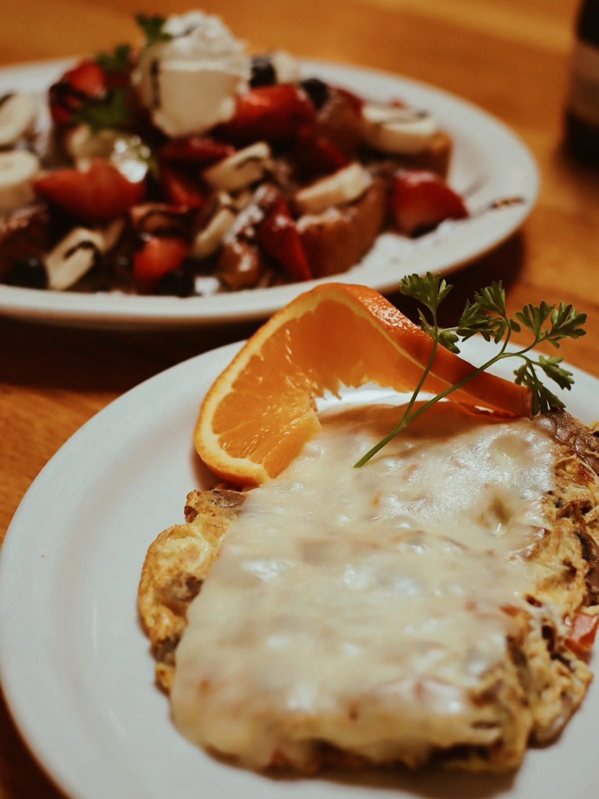 Loaded farmhouse omelette topped with melted cheese